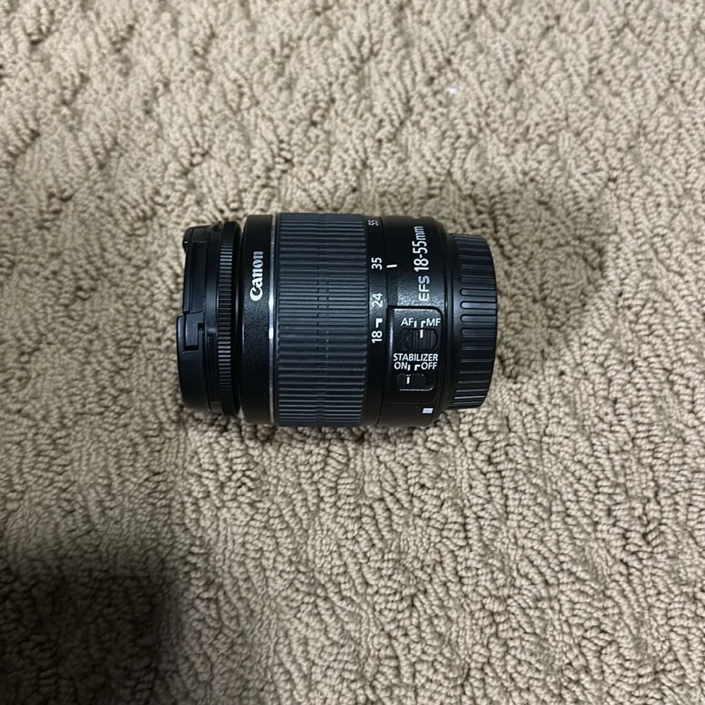 Canon eos rebel t3i with case and two lenses.
